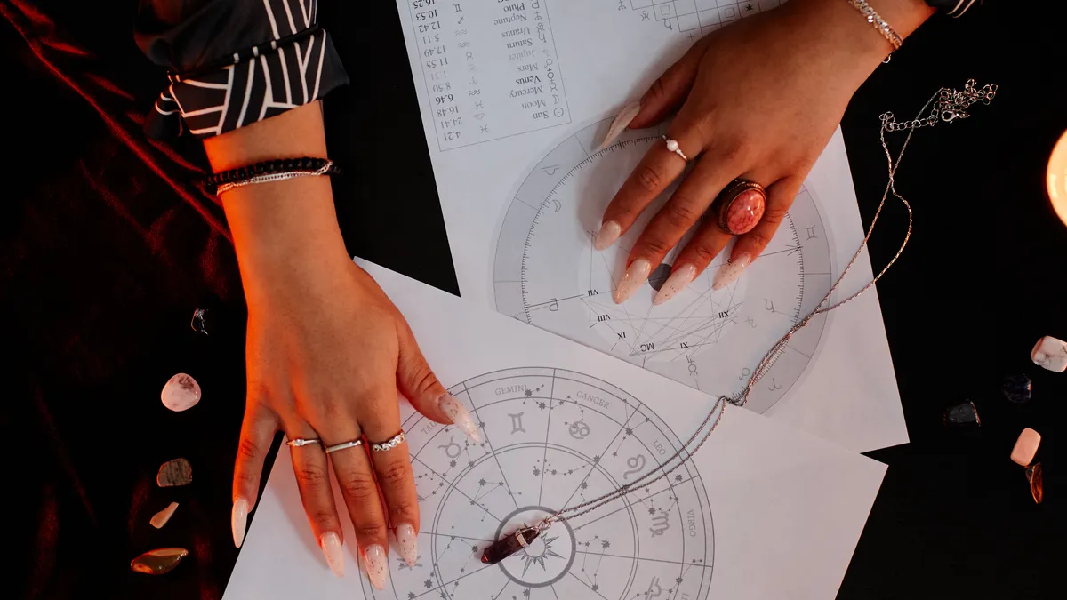 adult children of emotionally immature parents: hands reading astrology chart illustration